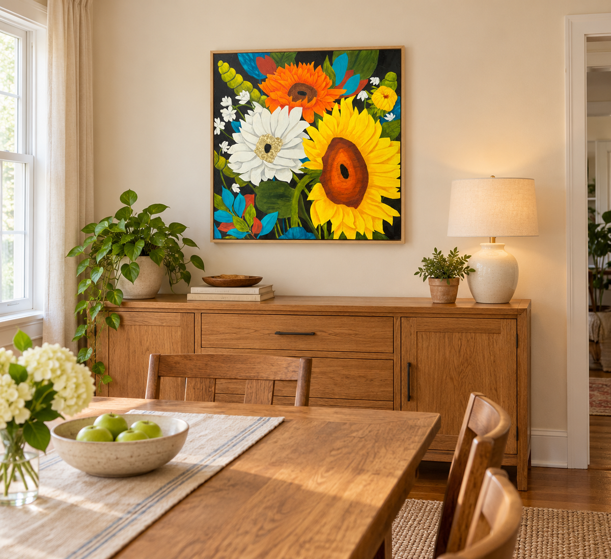 'The More the Merrier' sunflower painting by Becky Potter shown hanging in a dining room